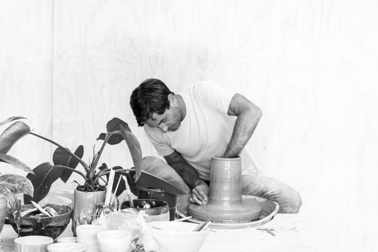 Kristian Hawker doing pottery