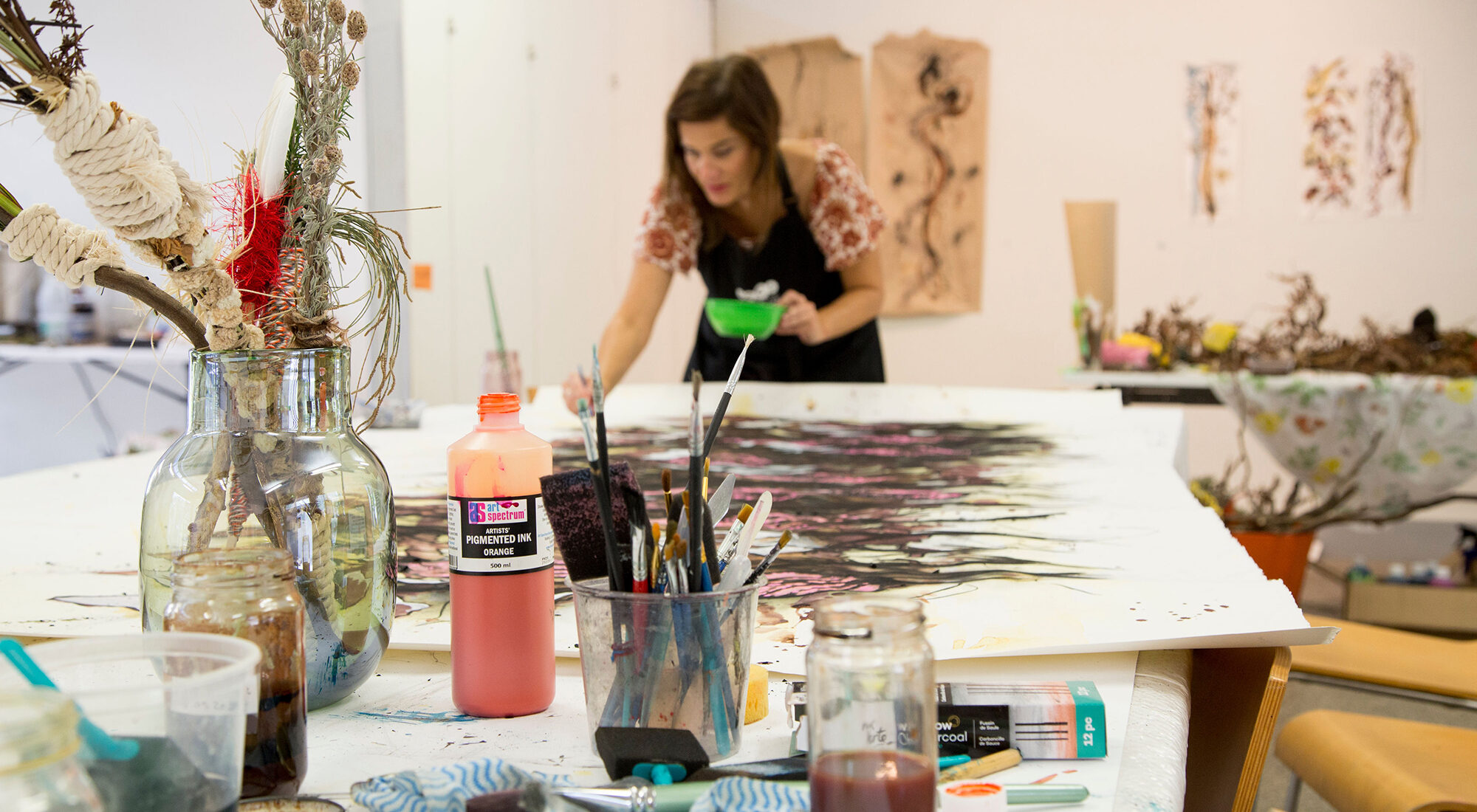 A person making art in their studio.