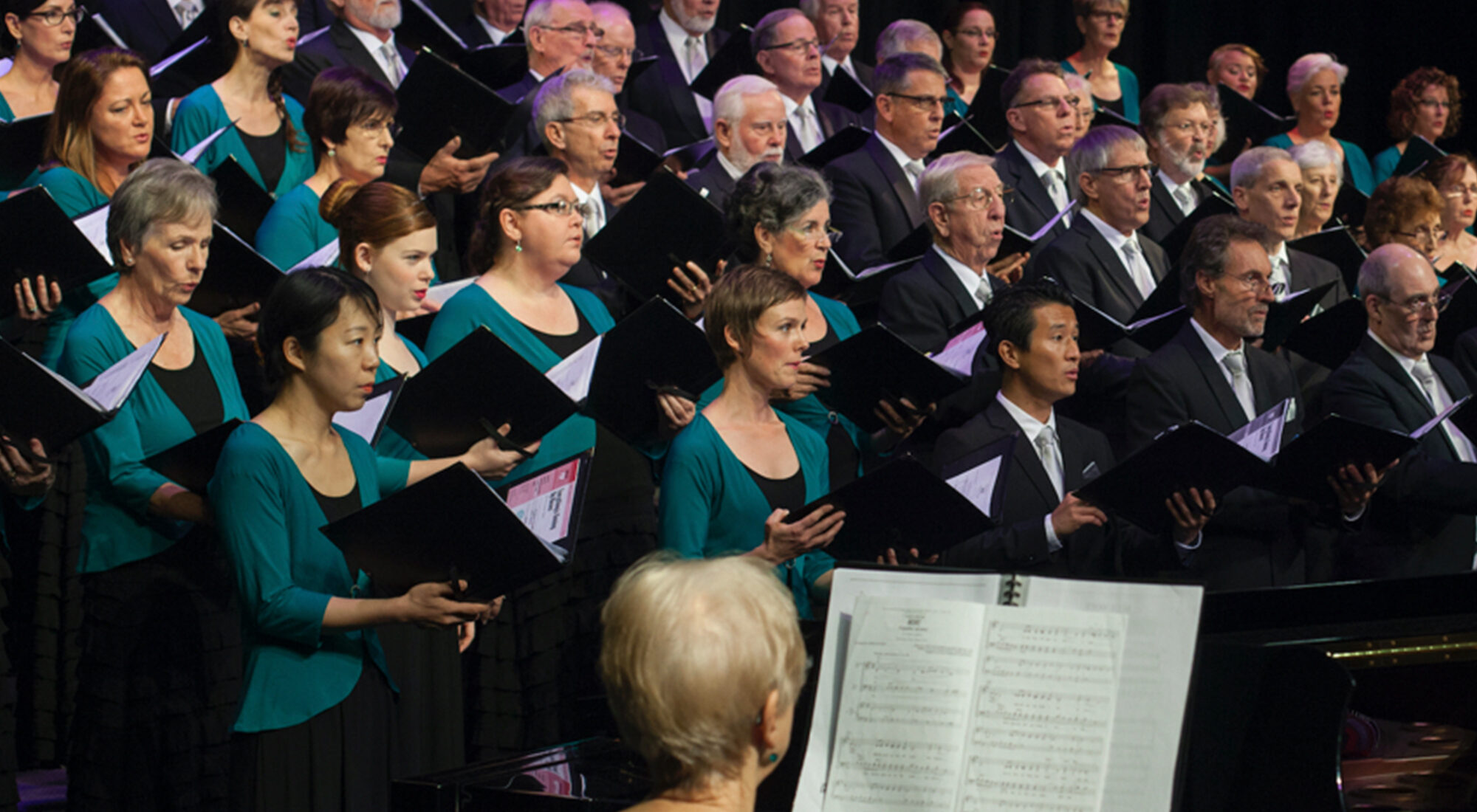 A photo of a choir singing.