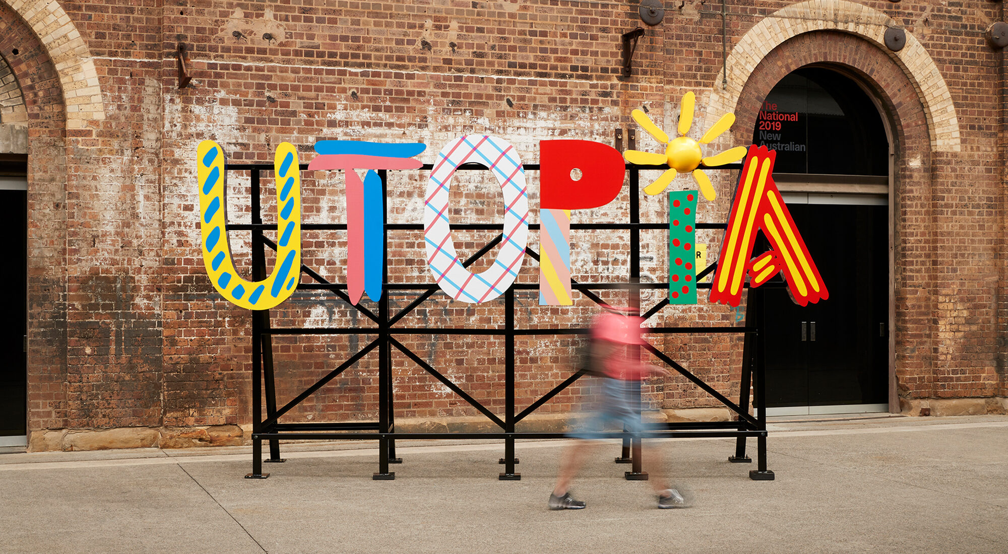 A colourful sign saying 'Utopia'.
